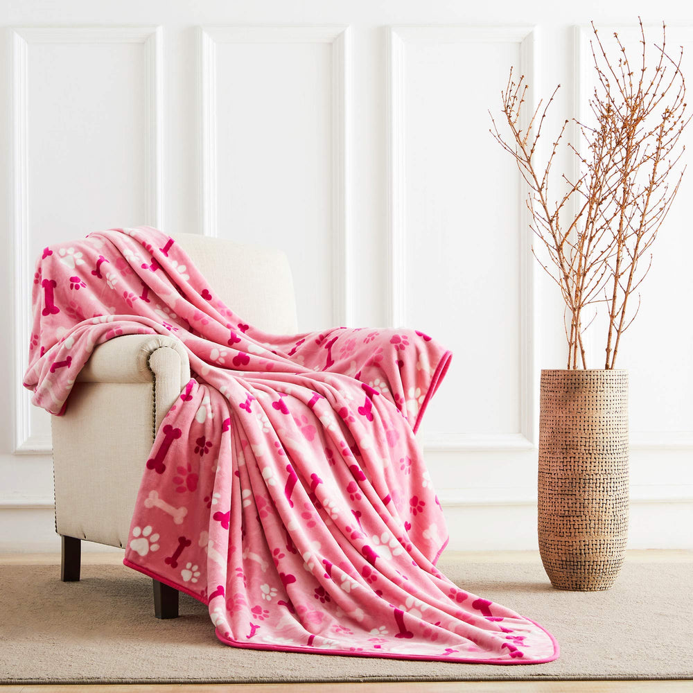 Allisandro dog blanket on sofa shows inviting lounging during movie nights.