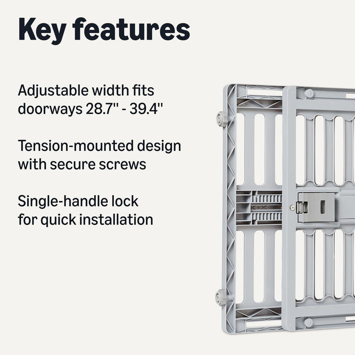 Amazon Basics dog gate in doorway demonstrates tool-free setup with tension mounting