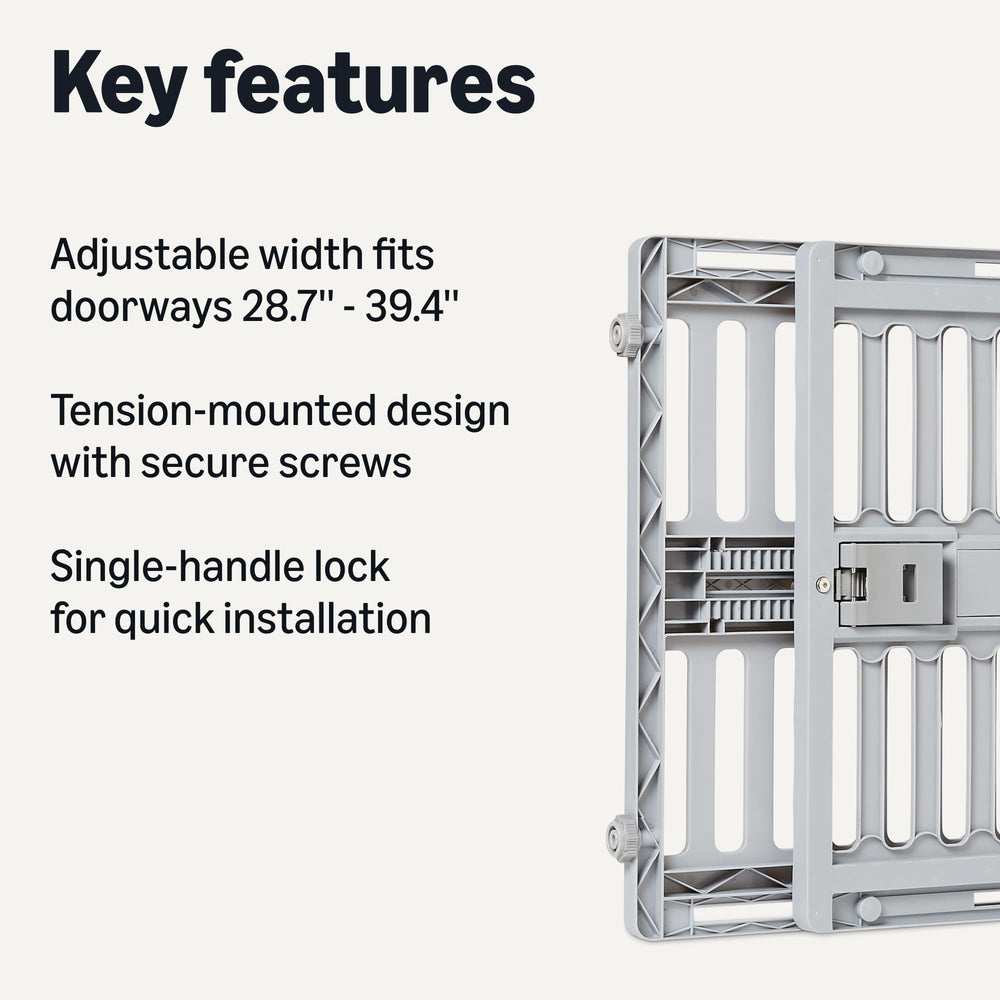 Amazon Basics dog gate in doorway demonstrates tool-free setup with tension mounting