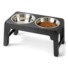 Amazon Basics elevated dog bowls stand during assembly showing quick setup and height adjustability