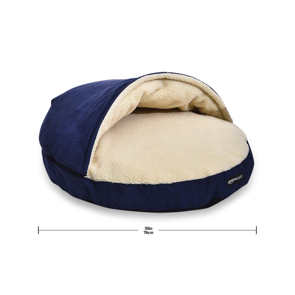Amazon Basics pet cave bed blue usage image for small to medium dogs.