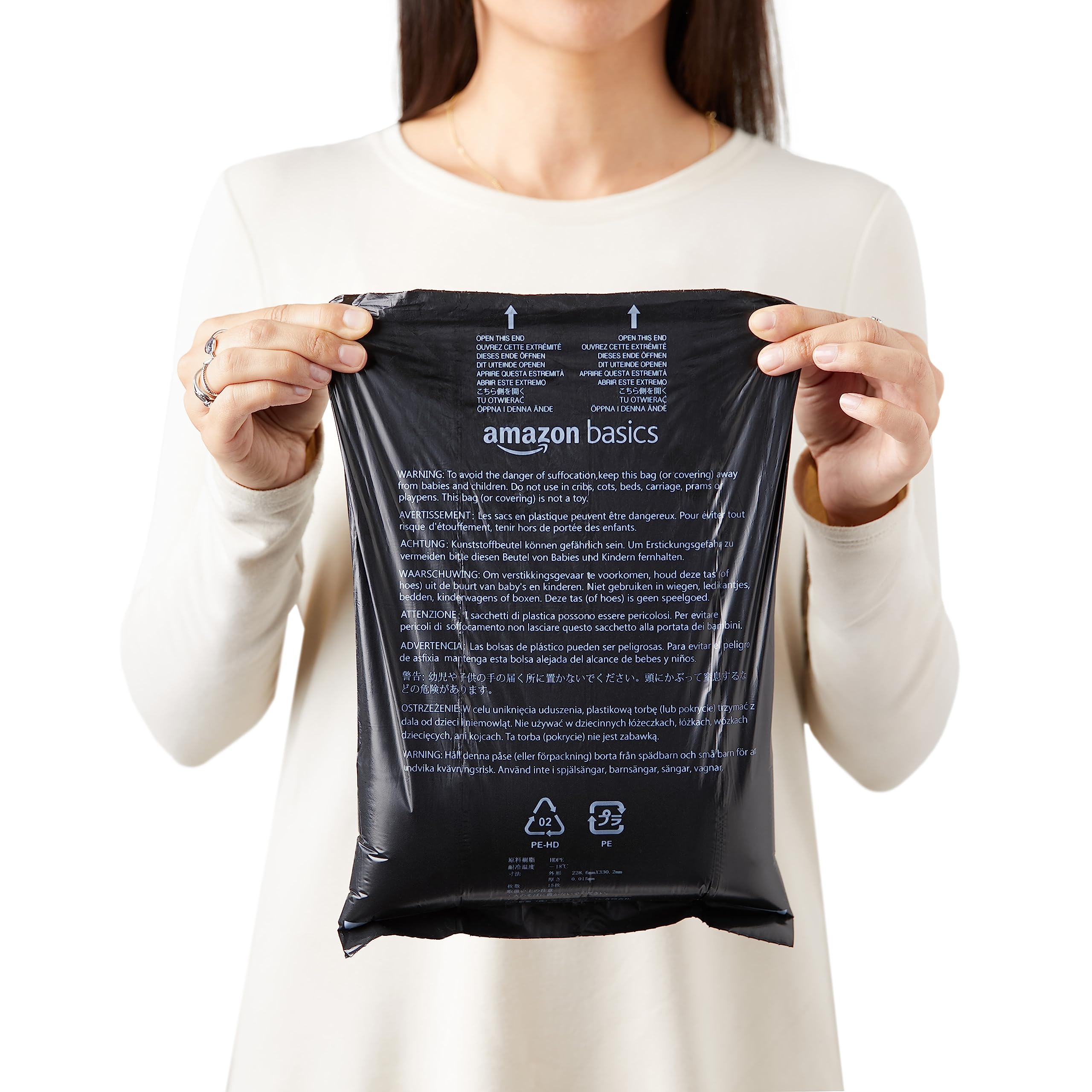 Amazon Basics poop bag rolls showing 15 bags per roll for easy refills.