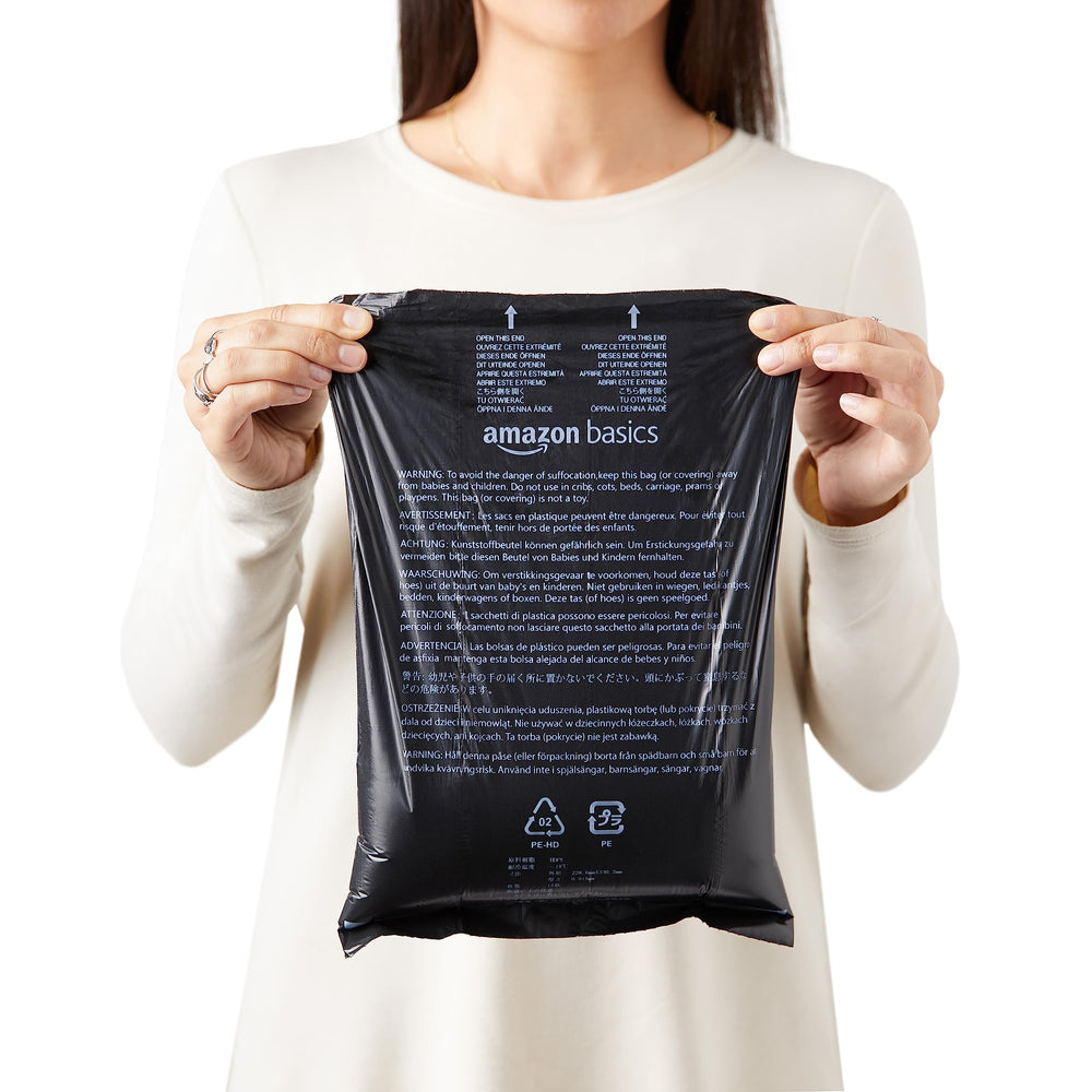 Amazon Basics poop bag rolls showing 15 bags per roll for easy refills.