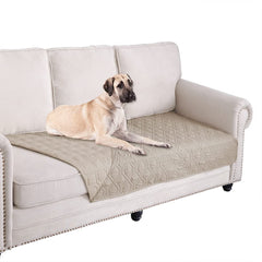 Ameritex waterproof blanket reverses on sofa, protecting furniture from pet use.