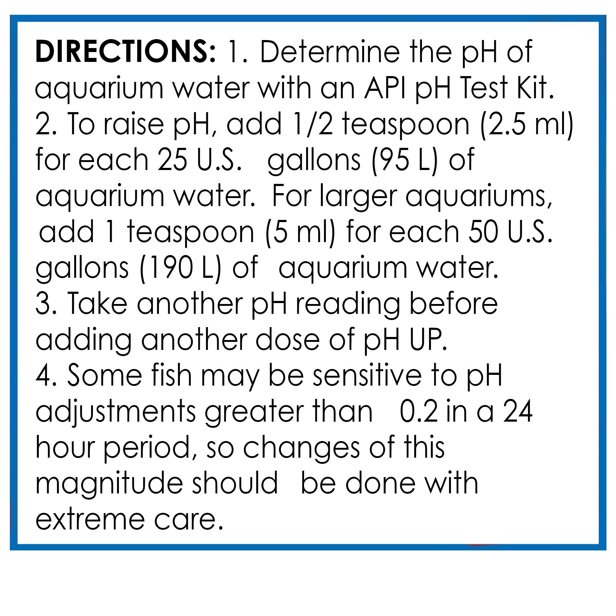 API pH UP bottle beside aquarium with happy community fish