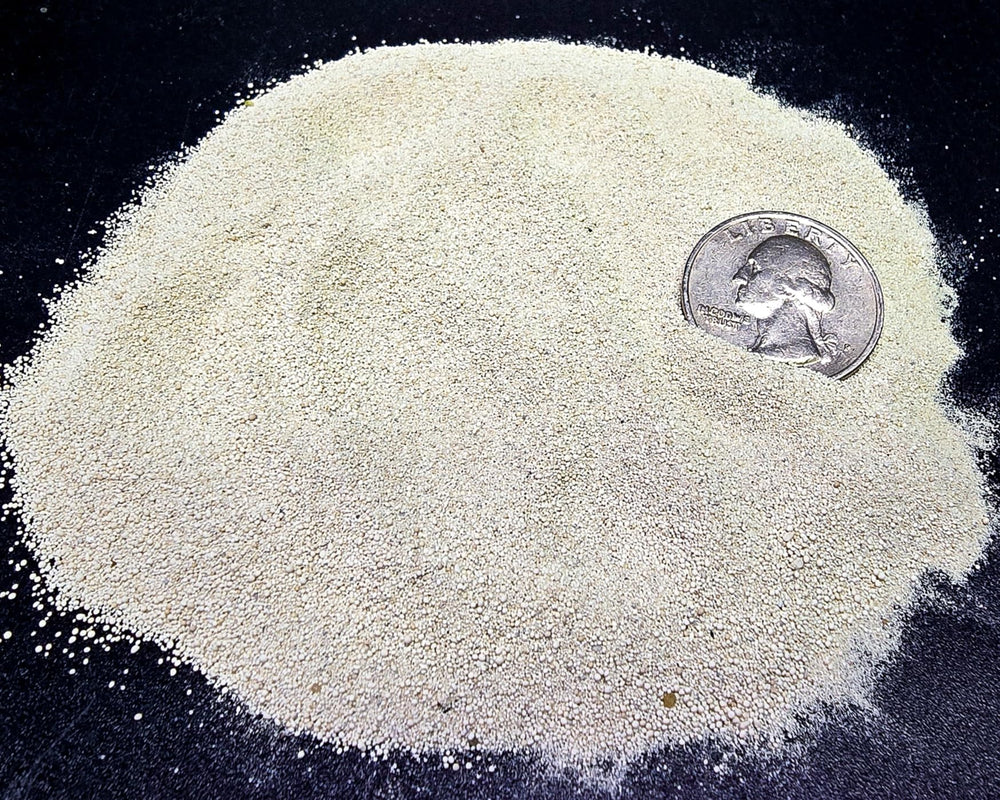 Aqua Natural oolitic aragonite sand laid in a tank bed supports bacteria and grain stability.