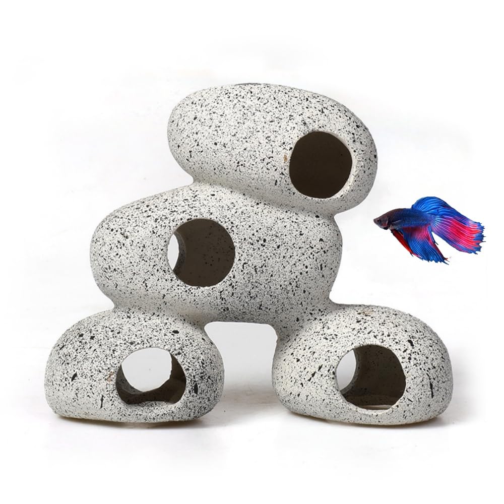 AWXZOM resin rock cave with moss creates natural hiding spots for small fish.