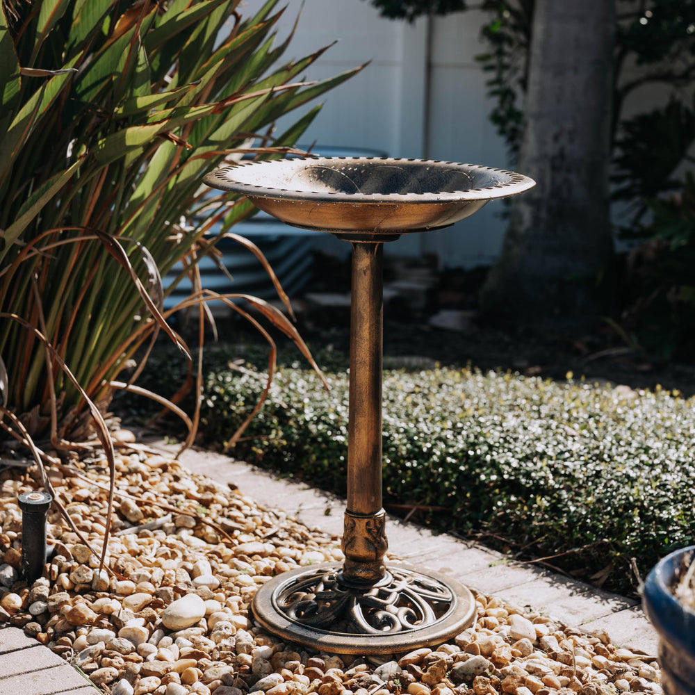 Backyard Expressions bird bath with three ground stakes for added stability in yards.