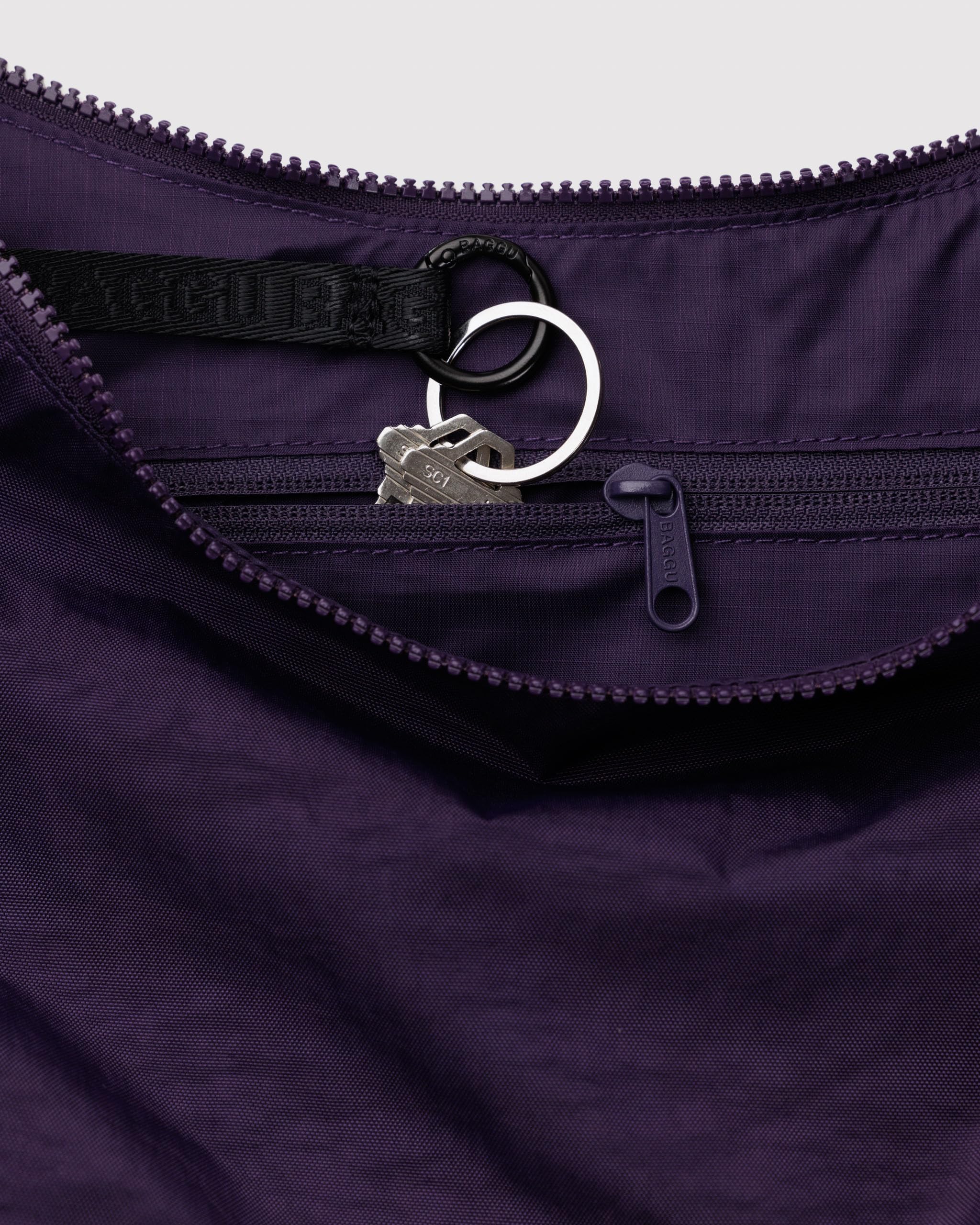 BAGGU Medium Nylon Crescent Bag Fig close-up highlighting durable recycled fabric.