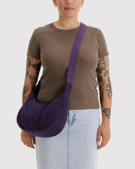 BAGGU Crescent Bag Fig side view showing compact profile and adjustable strap.