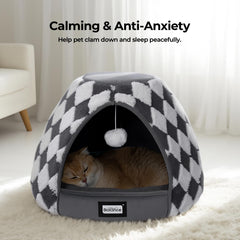 BALANCE cat bed with hanging toy ball at entrance invites playful rest.