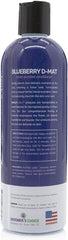 Pouring Bark2Basics conditioner to loosen mats during bath.