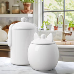 Barnyard Designs cat treat container with airtight lid on a kitchen counter.