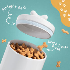 Barnyard Designs white dog treat canister on a kitchen counter display.