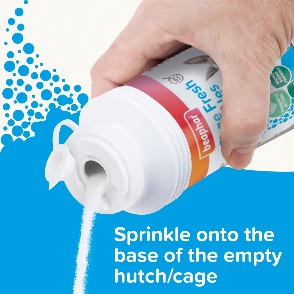 Beaphar Cage Fresh Granules being sprinkled to neutralize cage odours.