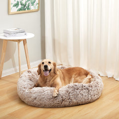 Bedfolks round fluffy dog bed closeup showcases plush fur and snug design.