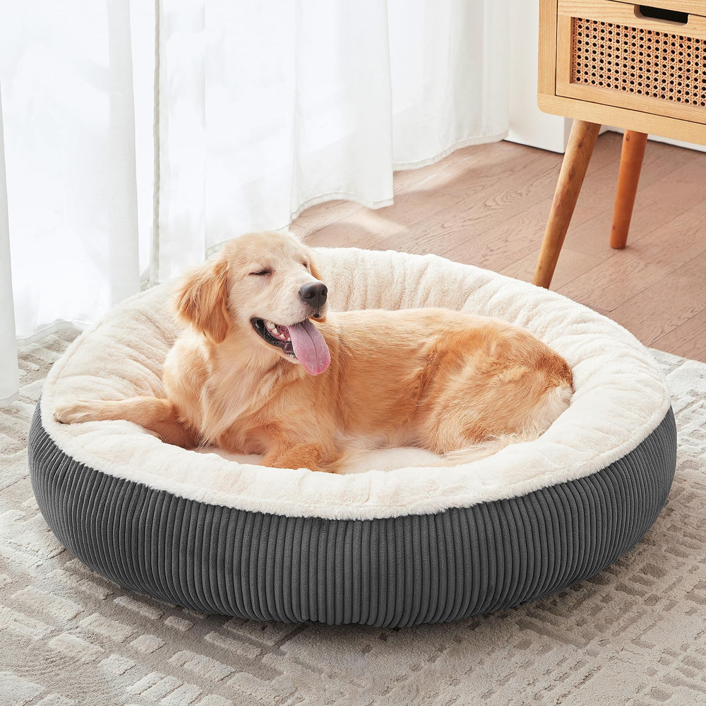 BedStill donut bed in large dark grey with faux fur for cozy lounging and relaxation.