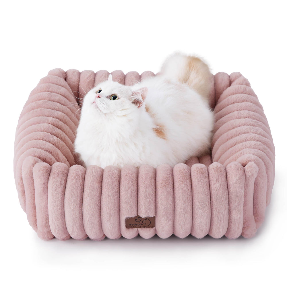 Bedsure ComfyFleece bed top view shows a soft blush pink cushion for small pets' cozy naps.