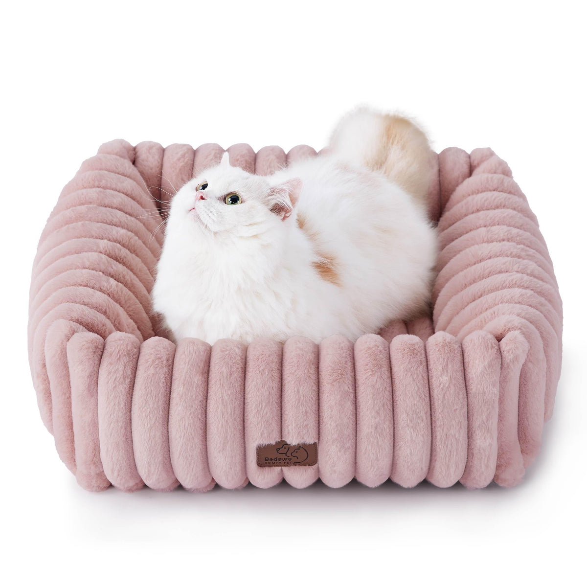 Bedsure ComfyFleece bed top view shows a soft blush pink cushion for small pets' cozy naps.