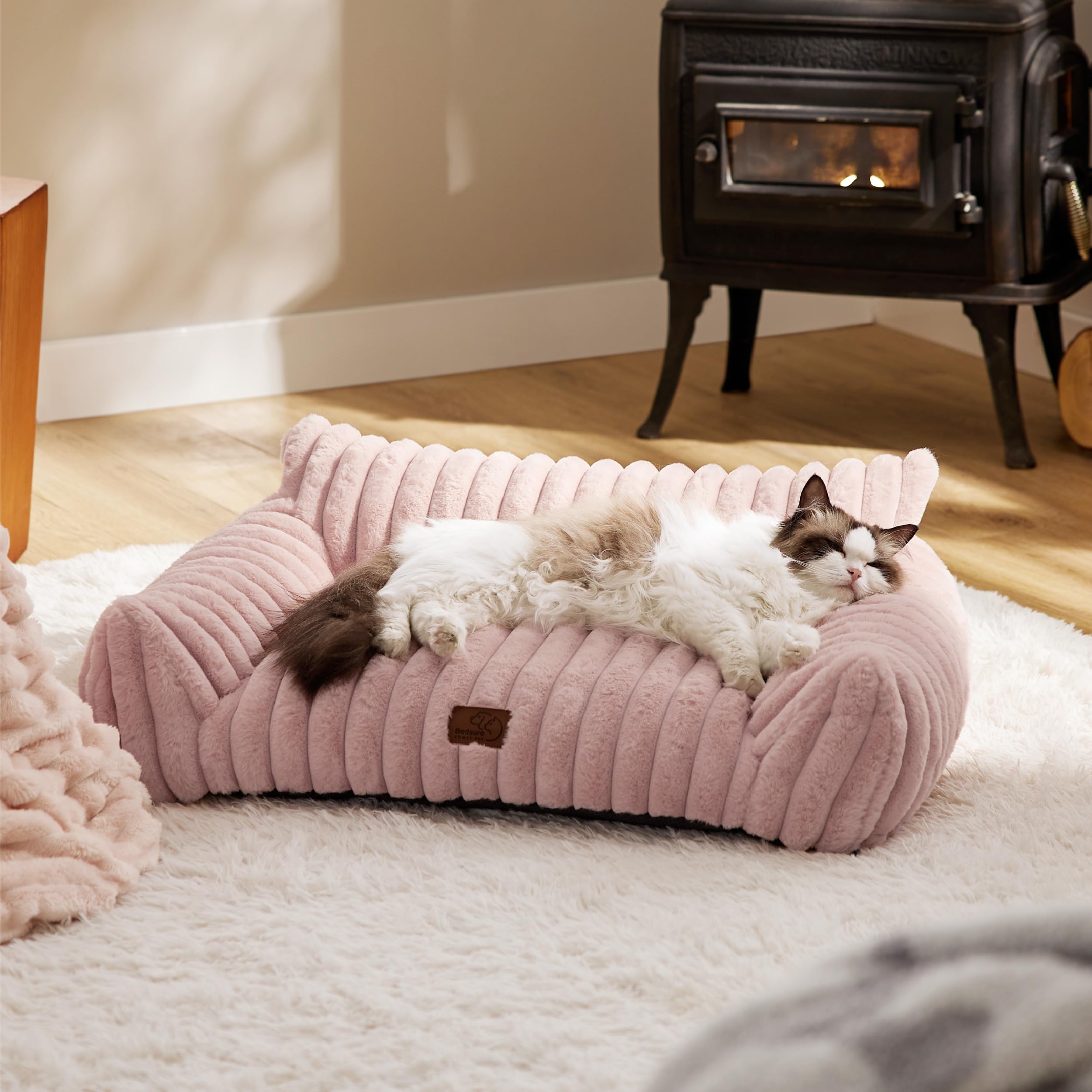 Bedsure ComfyFleece cat couch in use by a small dog for cozy lounging