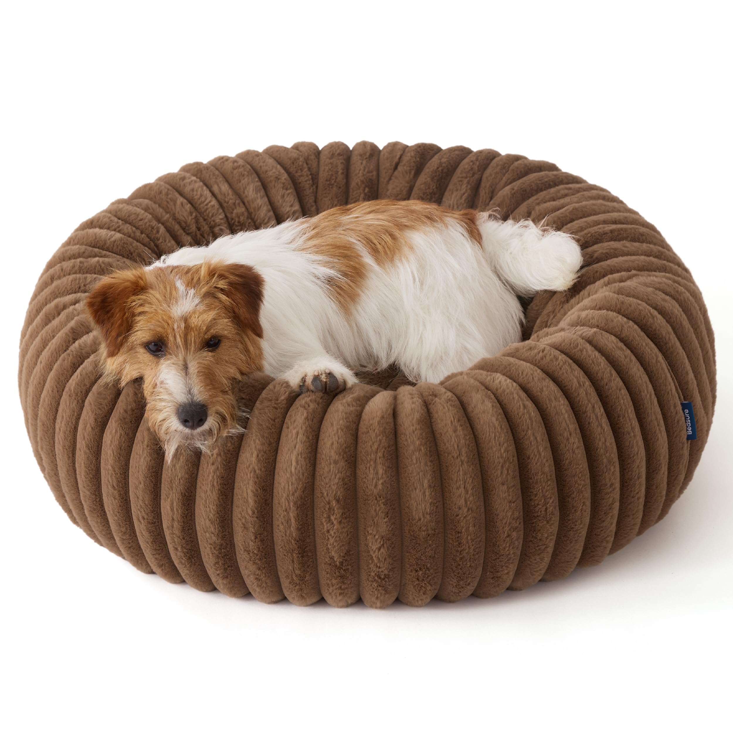Bedsure ComfyFleece Donut Bed cozy nap scene in camel brown.