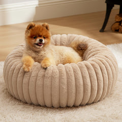 Bedsure ComfyFleece Donut bed with round faux-fur cover for cozy naps.