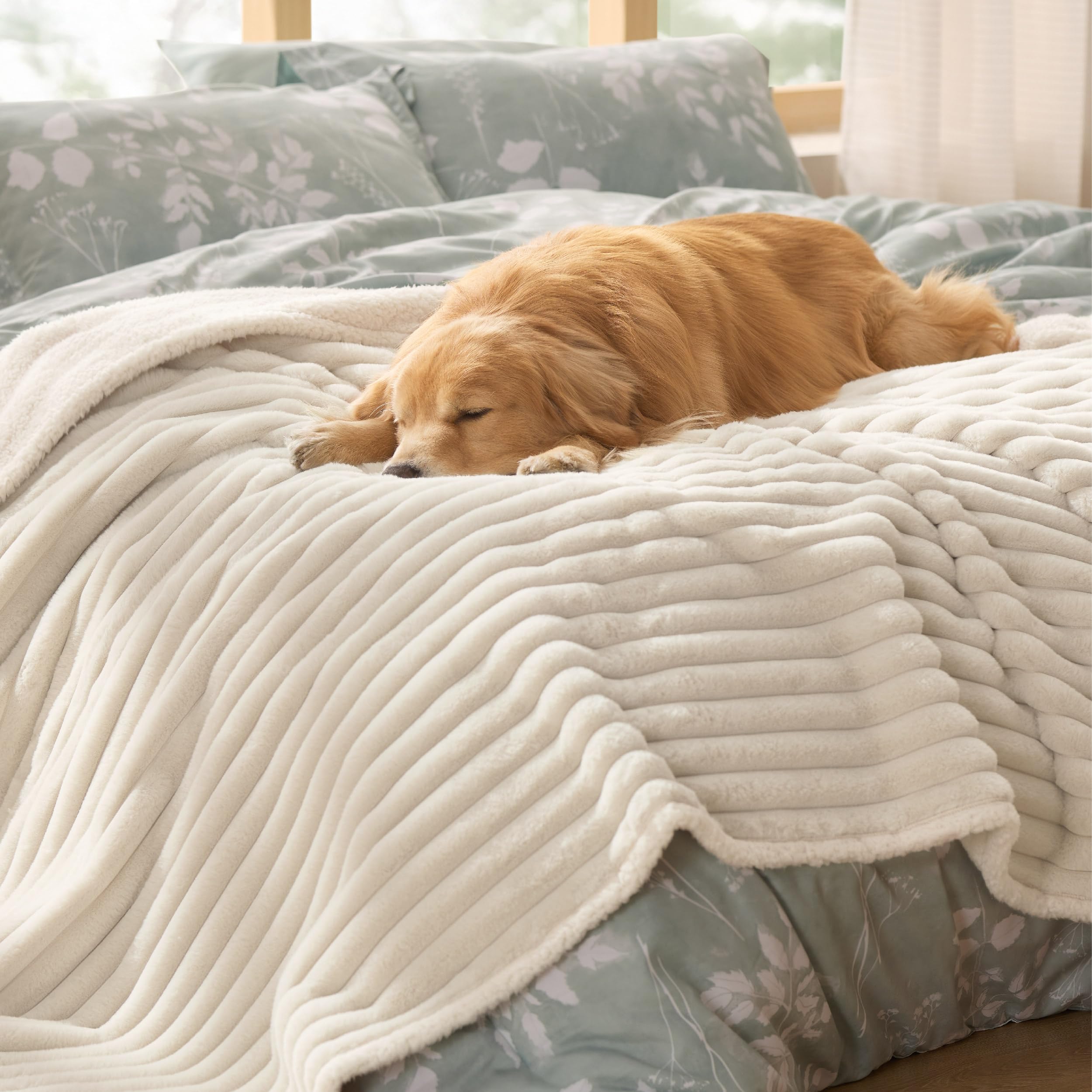 Bedsure ComfyFleece waterproof dog blanket 60x80 cream protects furniture from spills and fur.