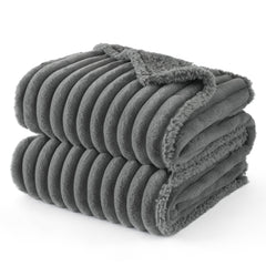 Bedsure ComfyFleece waterproof-dog-blanket on a couch protects furniture from spills and fur