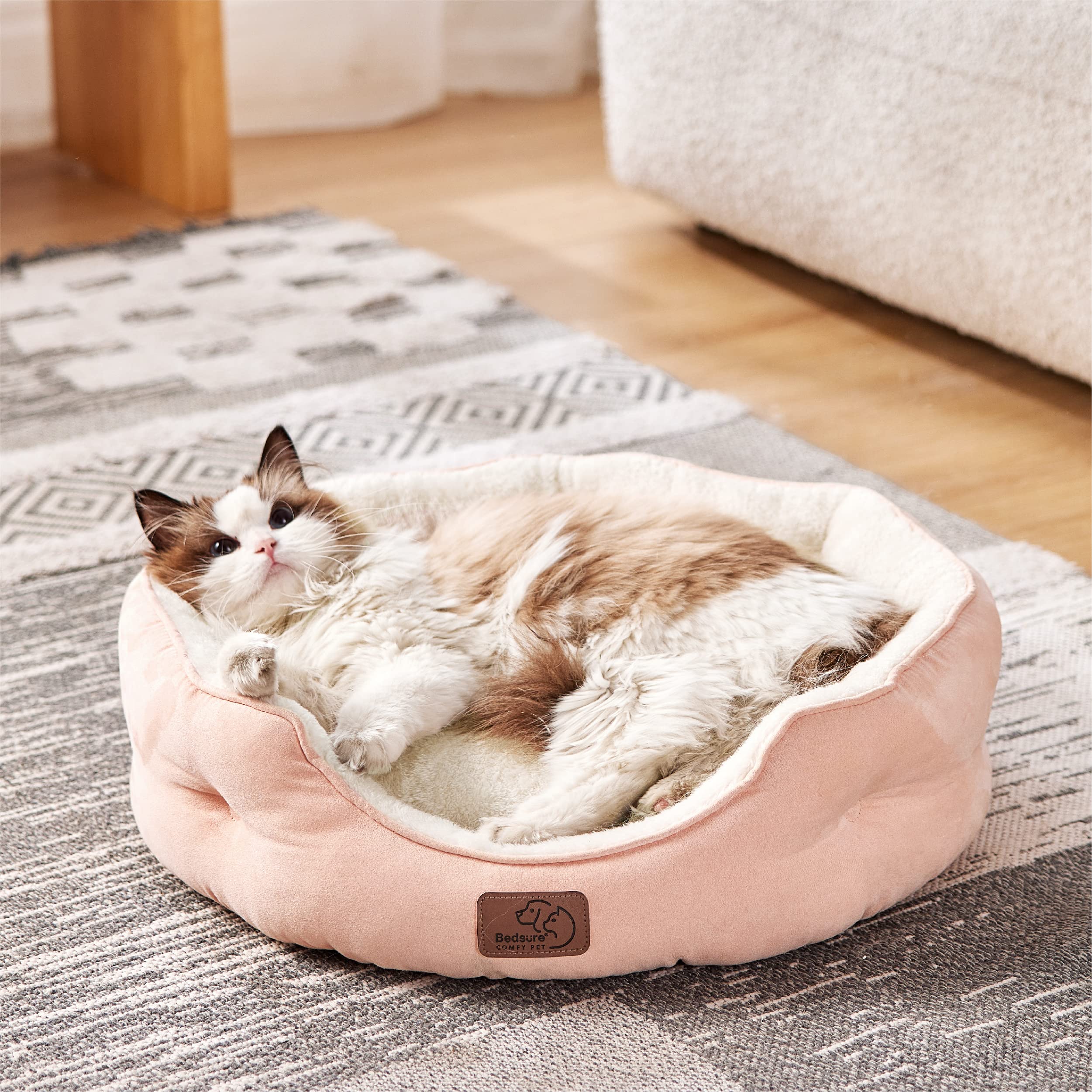 Bedsure dog bed with round bolster for secure, comfortable lounging.