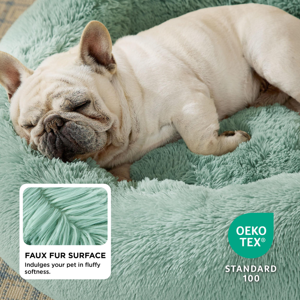 Bedsure donut bed with raised rim plush faux fur for head and neck support.