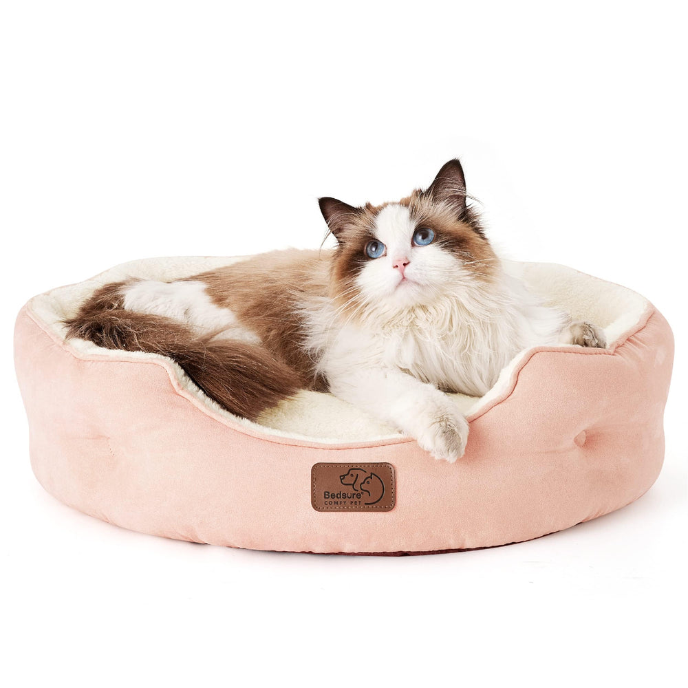Bedsure round cat bed with plush sherpa peach pink for warm, cozy naps.