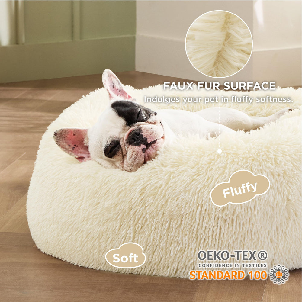 Bedsure round pet bed with non-slip base helps stay in place during naps.