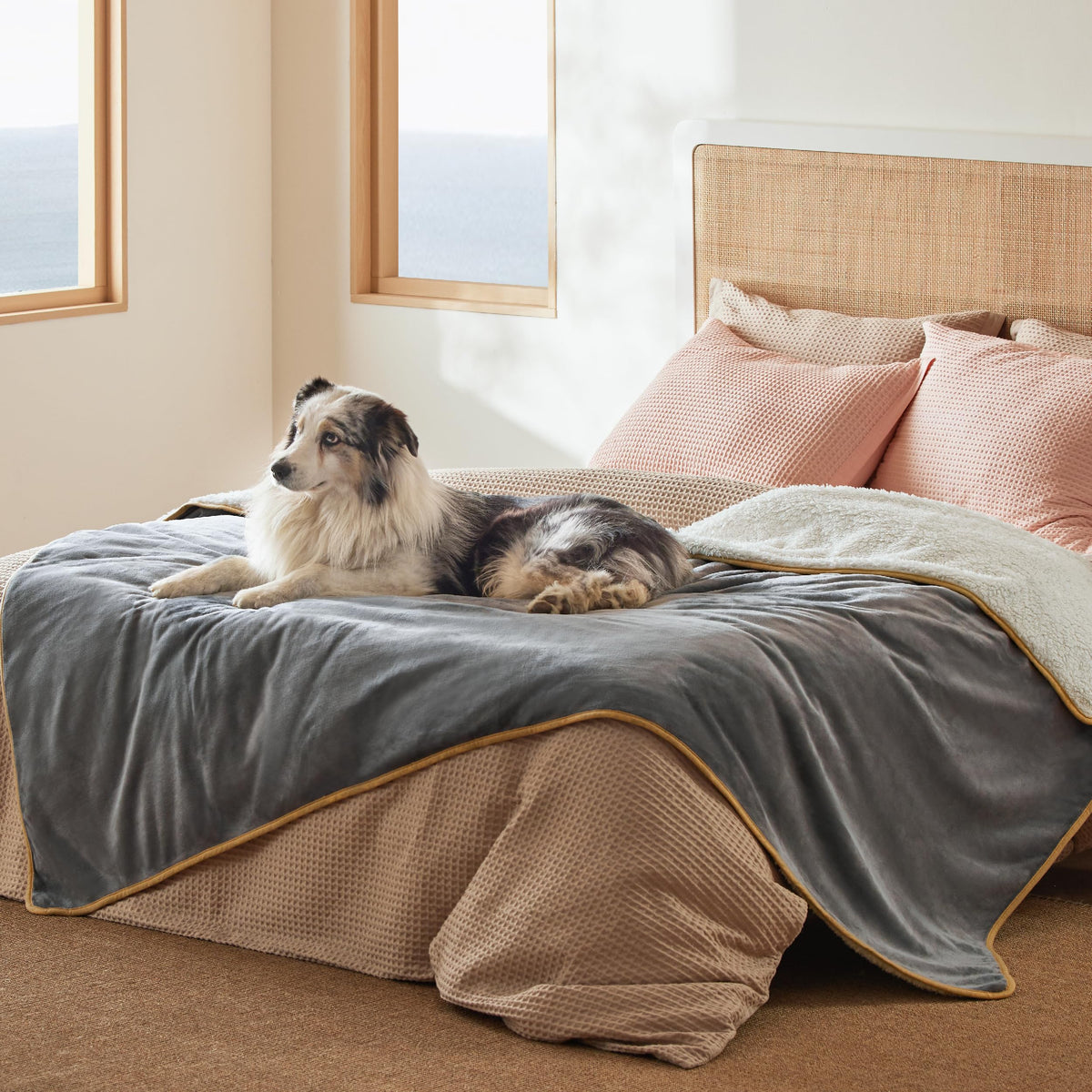 Bedsure waterproof blanket on a bed, 80x60, gray, protects against spills.