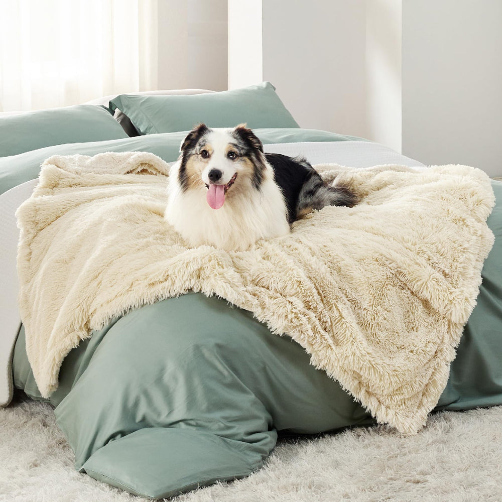Bedsure waterproof dog blanket in cream with calming faux fur for cozy naps
