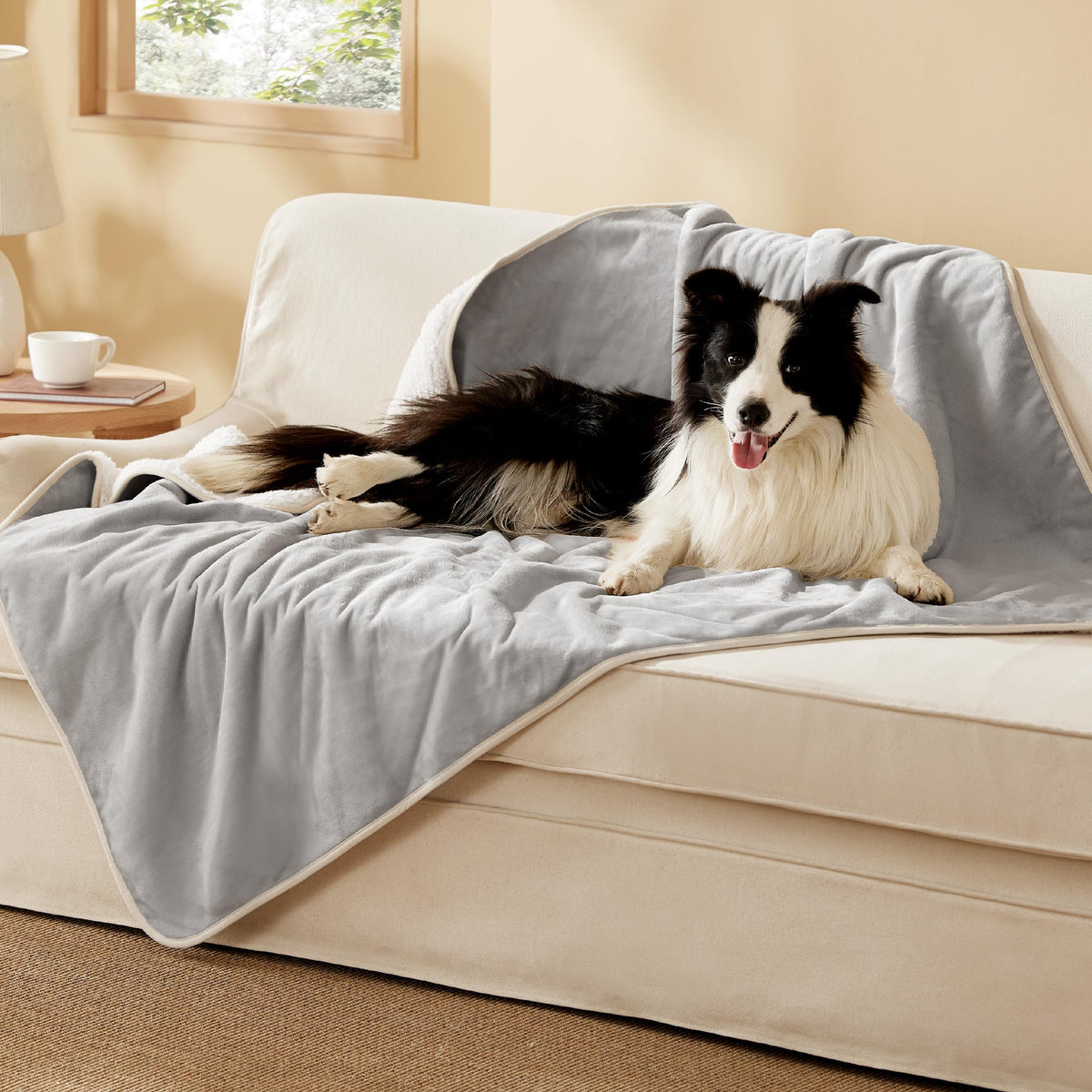 Bedsure waterproof dog blanket with Sherpa side for warmth and spill protection.