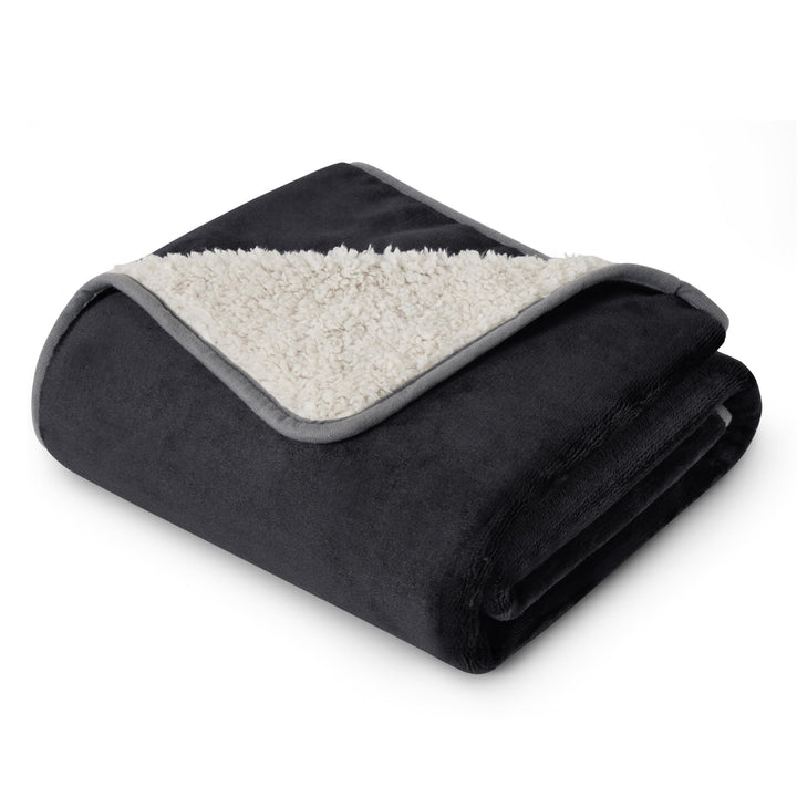 Bedsure waterproof Sherpa blanket on bed shields furniture while keeping you warm