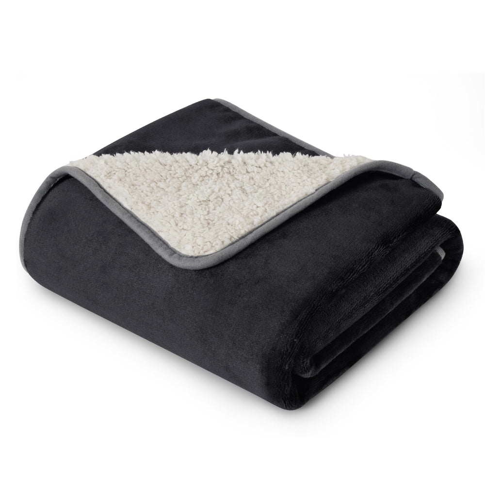 Bedsure waterproof Sherpa blanket on bed shields furniture while keeping you warm