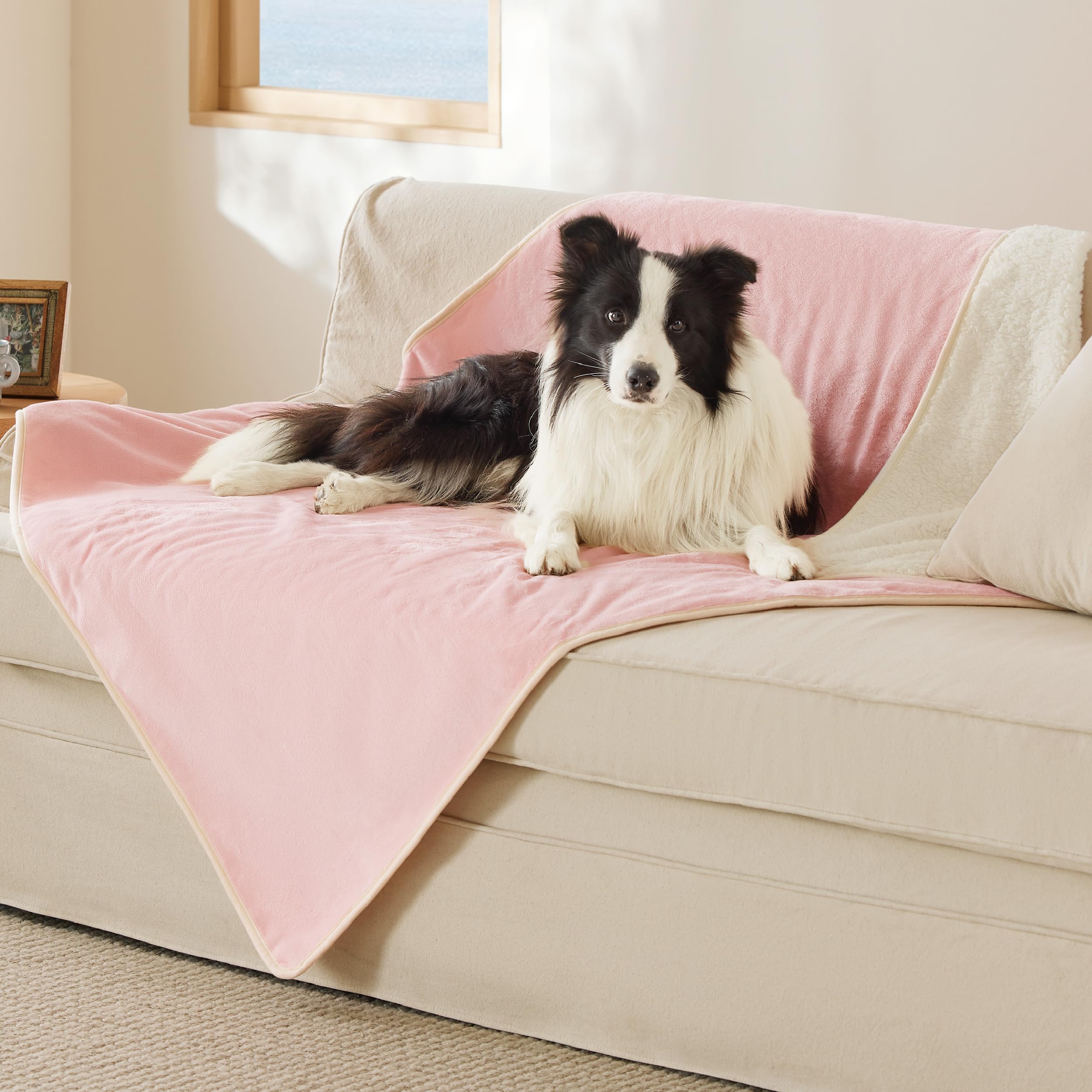 Bedsure waterproof XL dog blanket in pink protects furniture from spills.