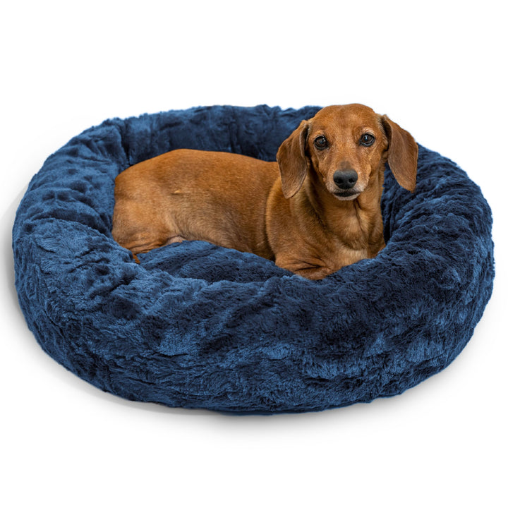 Best Friends by Sheri Donut Bed in navy creates a cozy haven for dogs up to 25 lbs.