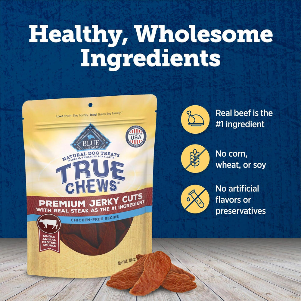 Dog enjoying Blue Buffalo True Chews Jerky Cuts Beef treat during playtime