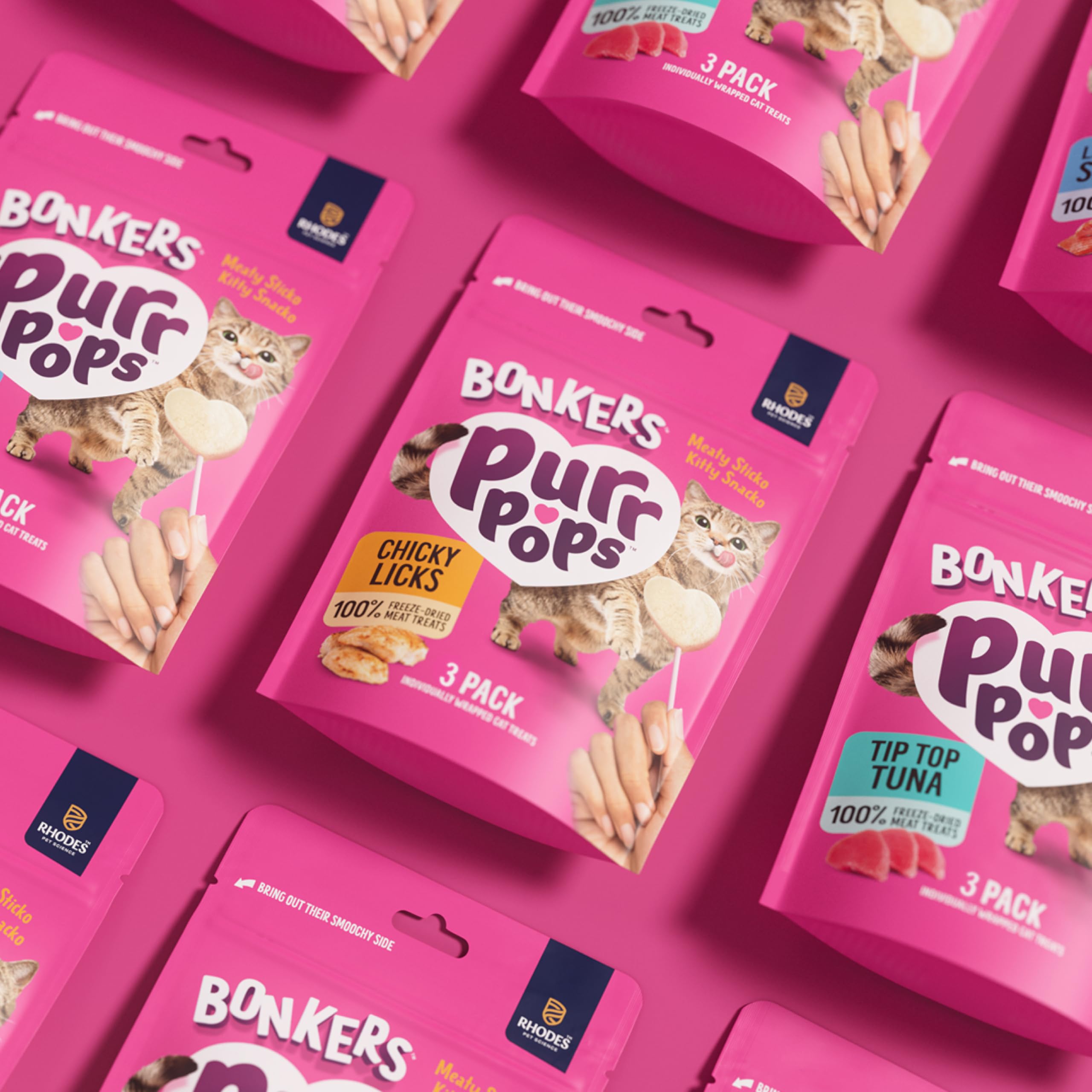 Cat enjoying Bonkers Purrpops treat, ideal bonding moment during snack time.