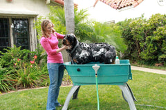 Booster Bath drain hose directs water away to keep you dry