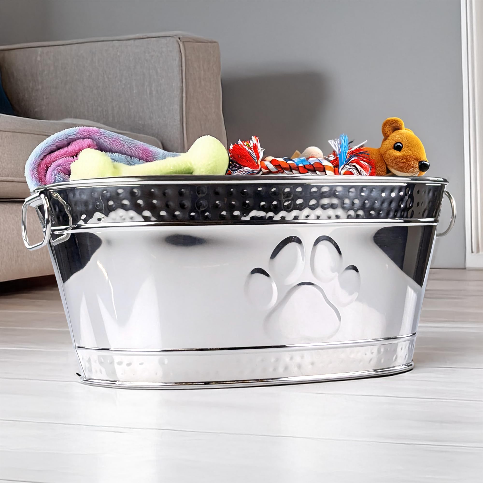 Oval-shaped dog toy storage bin provides ample space for toys and leashes.