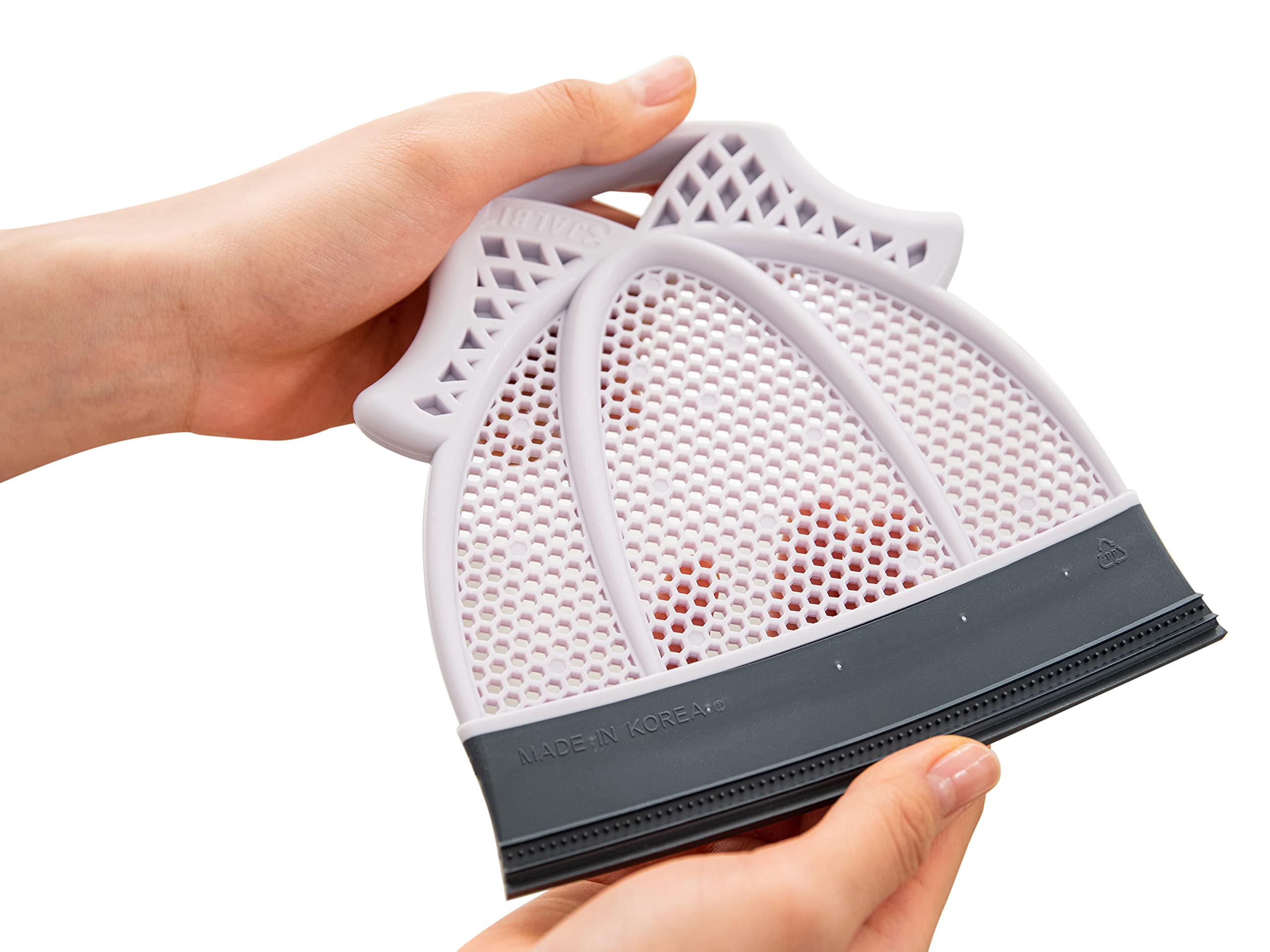 Broombi Pet Hair Remover quad-blade cleans pet hair from upholstery and fabrics.