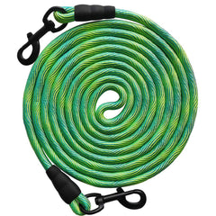 BTINESFUL 75 ft green dog tie-out rope in yard for secure roaming.