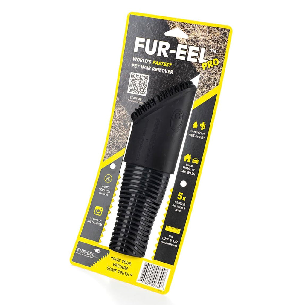 Buff Brite Fur Remover PRO II on a sofa mid-clean with hair being lifted