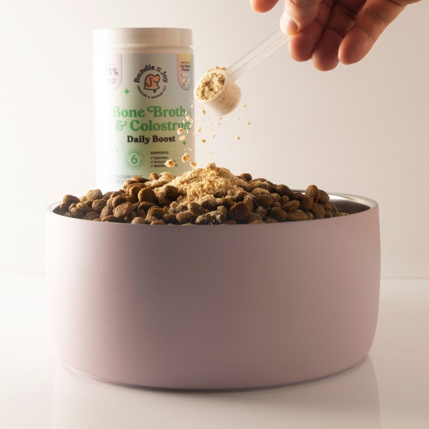 Bundle x Joy colostrum powder packet, premium immune-support ingredient.