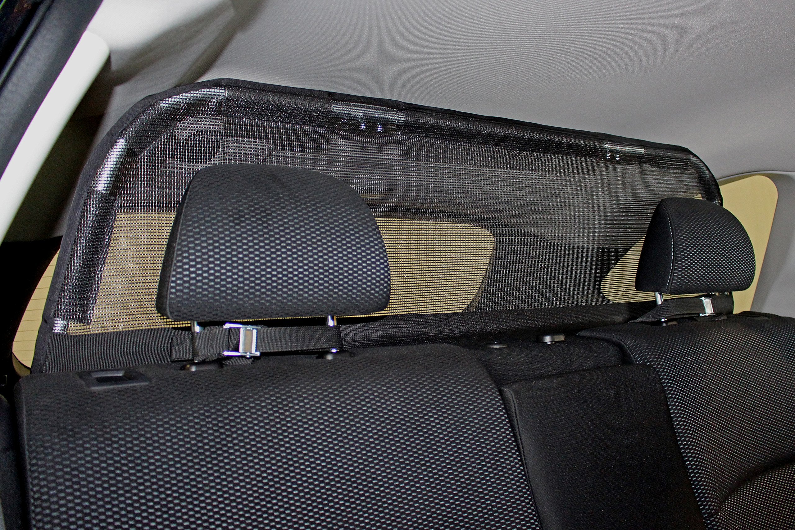 Bushwhacker cargo barrier frame side view demonstrates sturdy lightweight construction for secure restraint.