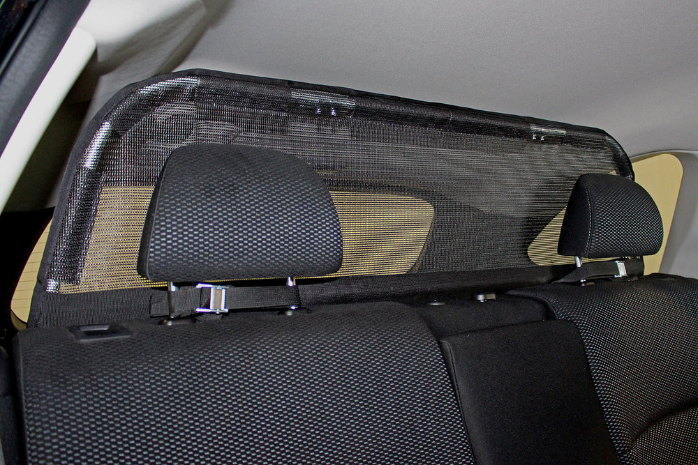 Bushwhacker cargo barrier frame side view demonstrates sturdy lightweight construction for secure restraint.