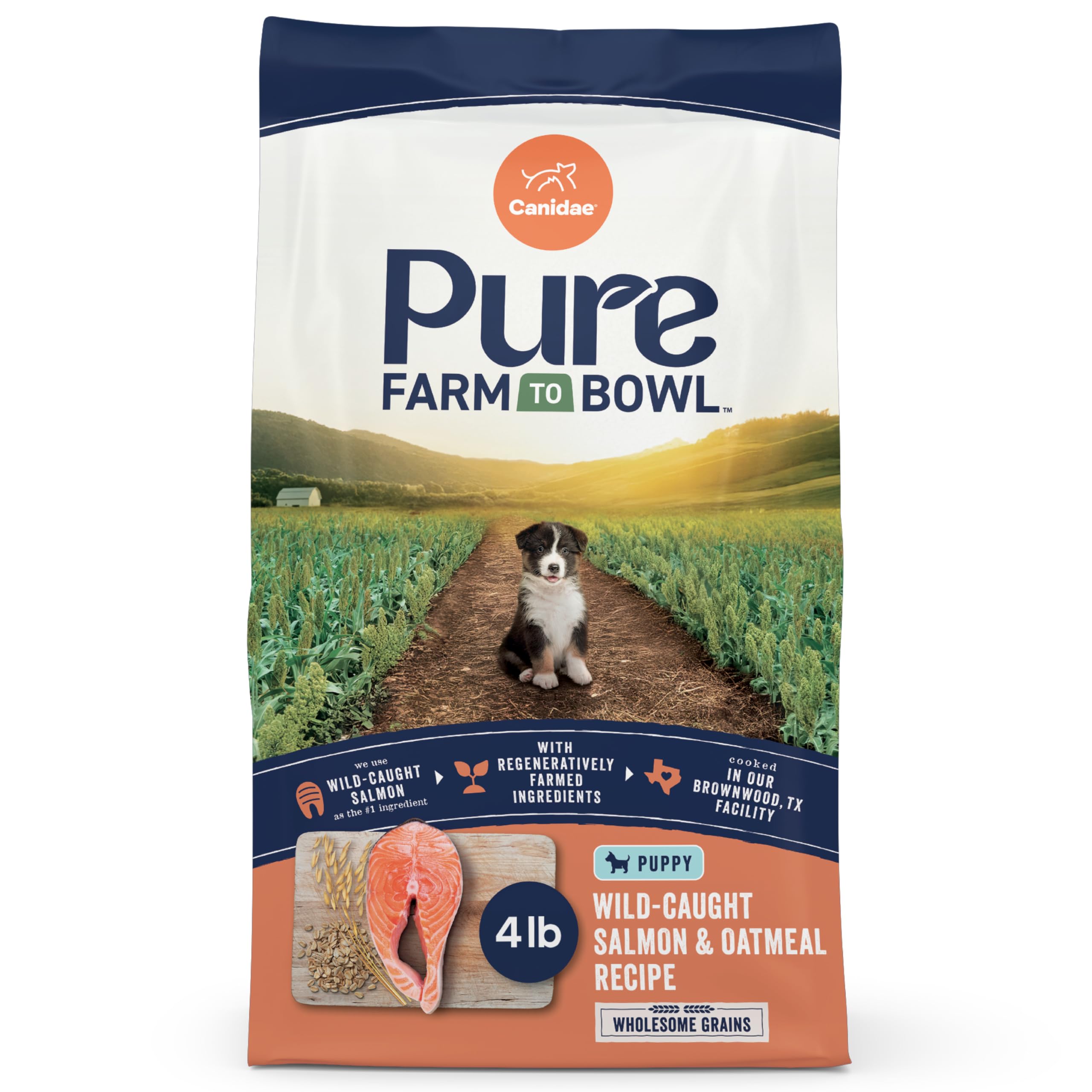 Canidae Pure Farm to Bowl puppy salmon bag close-up showing premium ingredients for growth.